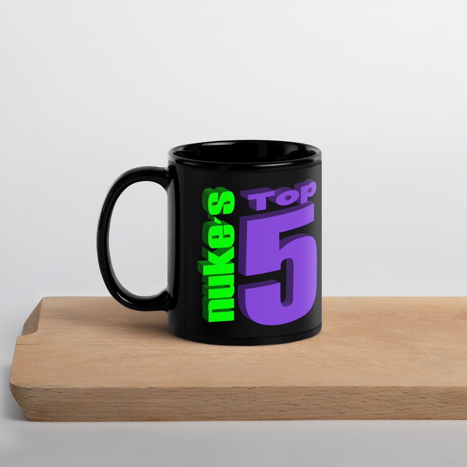 Front side of black mug with Nuke's Top 5 logo