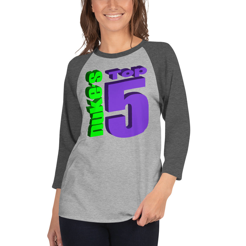 A woman wearing a Nuke's Top 5 logo grey baseball tee